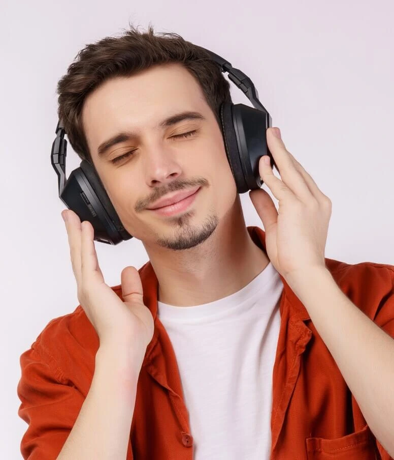 person wearing headphones listening to audio
