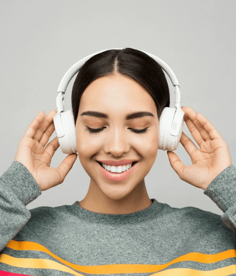 person wearing headphones listening to audio